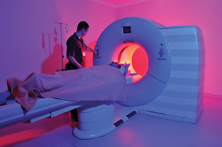 Magnetic Resonance Imaging machine – a series of dramatically lightened MRI images.